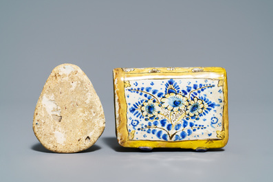 A manganese Dutch Delft miniature stove, a blue and white shell and a French book-shaped handwarmer, 18th C.