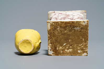 A manganese Dutch Delft miniature stove, a blue and white shell and a French book-shaped handwarmer, 18th C.