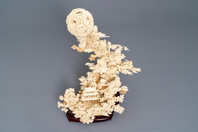 A fine Chinese ivory landscape with a puzzle ball, Canton, ca. 1920