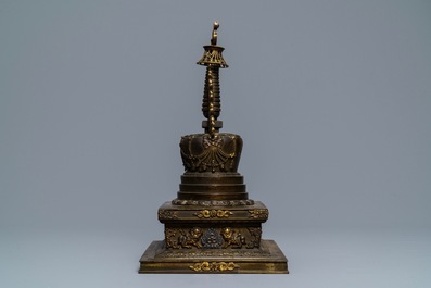 A large parcel-gilt inlaid bronze stupa, Tibet, 18th C.