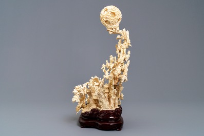 A fine Chinese ivory landscape with a puzzle ball, Canton, ca. 1920