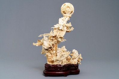 A fine Chinese ivory landscape with a puzzle ball, Canton, ca. 1920