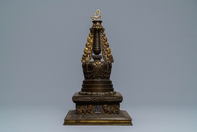 A large parcel-gilt inlaid bronze stupa, Tibet, 18th C.