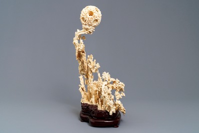 A fine Chinese ivory landscape with a puzzle ball, Canton, ca. 1920