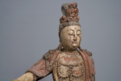 A Chinese polychrome wood group of Guanyin on a dragon, 18th C.