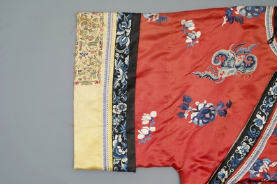 A Chinese woman's embroidered red silk side-opening informal coat, 19th C.
