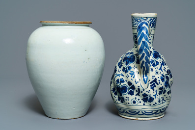 A Dutch Delft blue and white tobacco jar, a jug and three dishes, 18th C.
