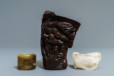 A Chinese jade archer's ring, a horn libation cup and a Beijing glass brush washer, 18th C. and later