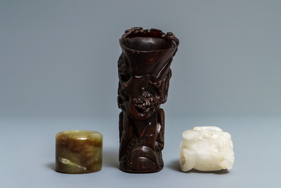 A Chinese jade archer's ring, a horn libation cup and a Beijing glass brush washer, 18th C. and later