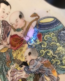 A fine Chinese famille rose 'ruby back' eggshell plate with a lady with three boys, Yongzheng