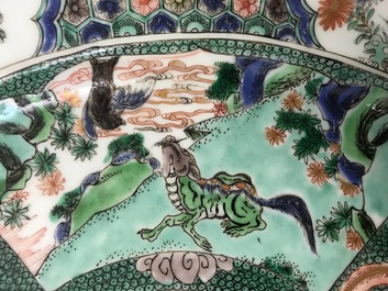 A pair of Chinese famille verte 'mythical beasts' chargers, Kangxi