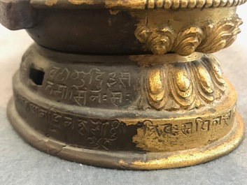 A Tibetan inscribed gilt bronze group of Manjusri and Prajnaparamita, 17/18th C.