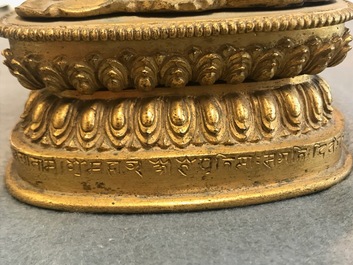 A Tibetan inscribed gilt bronze group of Manjusri and Prajnaparamita, 17/18th C.