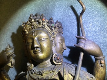 A Sino-Tibetan inlaid gilt bronze figure of Ushnishavijaya, 17/18th C.