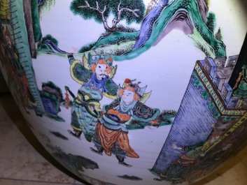 A large Chinese famille verte fish bowl with a narrative scene all-round, 19th C.