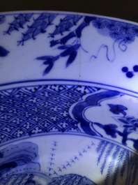 A pair of Chinese blue and white basins with figures in a garden, Yongzheng