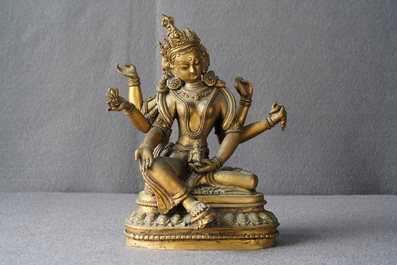 An inlaid gilt bronze figure of Vasudhara, Tibet or Nepal, 18/19th C.