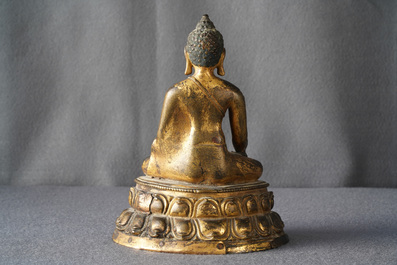 A gilt bronze figure of Buddha Shakyamuni, Tibet, 14/15th C.