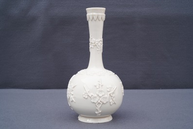 A Chinese Dehua blanc de Chine vase with applied floral designs, Kangxi
