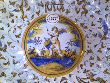 A lobed Dutch maiolica dish on foot with a putto surrounded by grotesques, Willem Jansz Verstraeten, Haarlem, ca. 1650