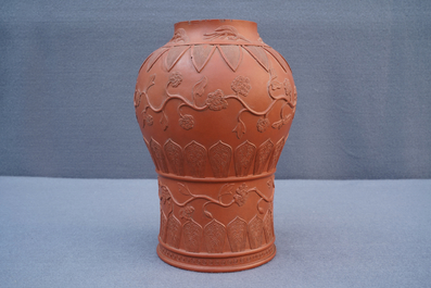 A Chinese Yixing stoneware baluster vase with applied design, Kangxi