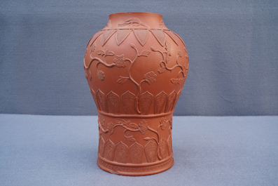 A Chinese Yixing stoneware baluster vase with applied design, Kangxi