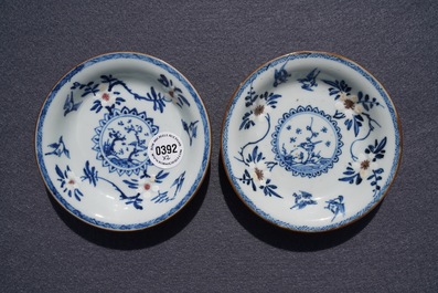 A pair of Chinese blue, white and underglaze red cups and saucers, Kangxi
