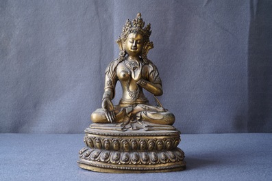 A Sino-Tibetan gilt bronze figure of a White Tara, Ming