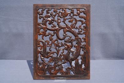 A pair of Chinese reticulated carved wooden panels, 18/19th C.