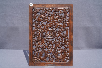 A pair of Chinese reticulated carved wooden panels, 18/19th C.