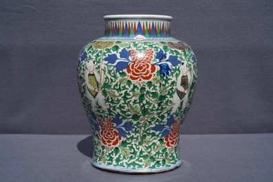 A Chinese wucai 'boys and peony scrolls' vase, 19th C.