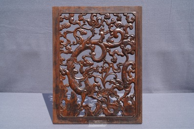 A pair of Chinese reticulated carved wooden panels, 18/19th C.