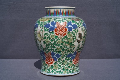 A Chinese wucai 'boys and peony scrolls' vase, 19th C.