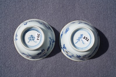 A pair of Chinese blue, white and underglaze red cups and saucers, Kangxi