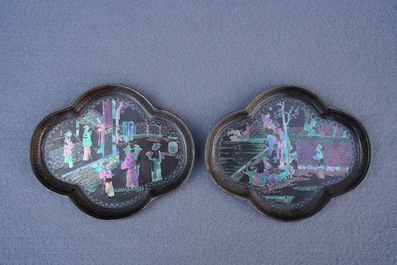 A pair of Chinese silver and lac burgaute quatrefoil cups and saucers, Kangxi