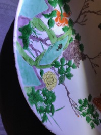 A Chinese blue and white 'Master of the Rock' dish and a famille verte dish, Kangxi