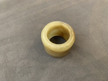 A Chinese jade archer's ring, a horn libation cup and a Beijing glass brush washer, 18th C. and later