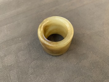 A Chinese jade archer's ring, a horn libation cup and a Beijing glass brush washer, 18th C. and later