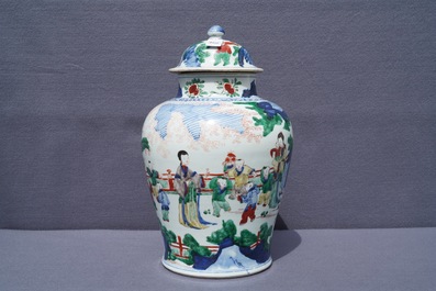 A Chinese wucai vase and cover with figures in a garden, seal mark, Transitional period