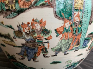 A large Chinese famille verte fish bowl with a narrative scene all-round, 19th C.