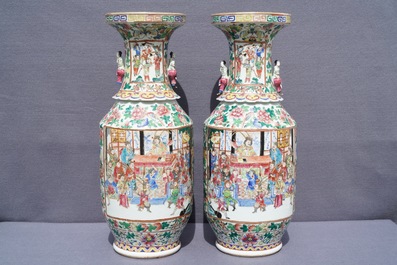 A pair of Chinese famille rose lady-handle vases, 19th C.