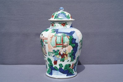 A Chinese wucai vase and cover with figures in a garden, seal mark, Transitional period