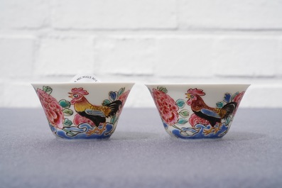 A pair of Chinese famille rose 'roosters' cups and saucers, Yongzheng/Qianlong