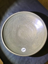 A Chinese Yaozhou celadon bowl with incised floral design, Song