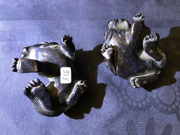 A pair of Chinese bronze 'lion' scroll weights and a seal, Ming and 18th C.