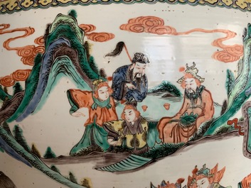 A large Chinese famille verte fish bowl with a narrative scene all-round, 19th C.