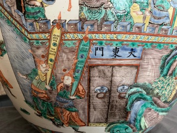 A large Chinese famille verte fish bowl with a narrative scene all-round, 19th C.