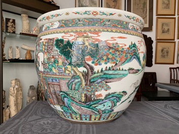 A large Chinese famille verte fish bowl with a narrative scene all-round, 19th C.