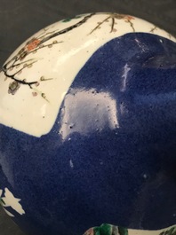 A Chinese famille verte powder blue-ground bottle vase, 19th C.