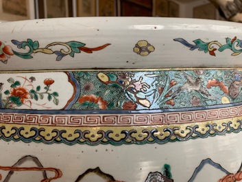 A large Chinese famille verte fish bowl with a narrative scene all-round, 19th C.